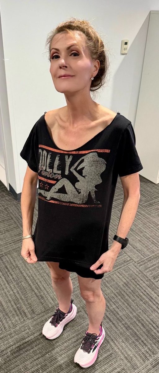 dagenmcdowell's tweet photo. I got ready to leave the office tonight and realized I had worn my Dolly t-shirt to work this morning — the one she gave me. 🦋 https://t.co/d9oV5wINdF