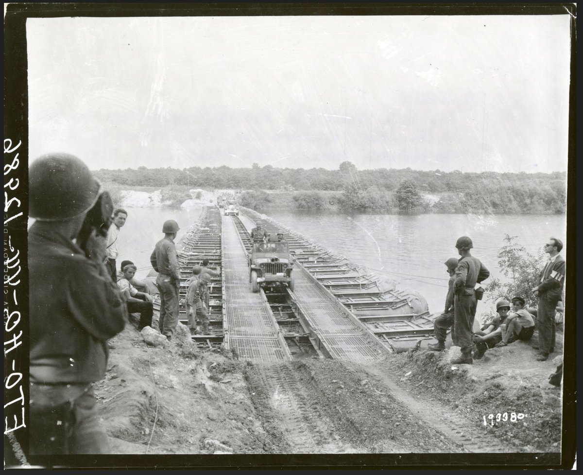PattonOwn's tweet photo. A Day with General Patton!

The Wehrmacht hoped the Seine would become the next barrier to the Allied advance. But Patton crossed it in an open Jeep, and became the first U.S. field army commander to do so!

August 26, 1944. Six nights earlier, infantrymen of Patton’s Third Army had crossed the Seine at Mantes-Gassicourt during a violent rainstorm. Engineers then built temporary bridges capable of carrying trucks, artillery and tanks.

Additional bridgeheads followed south of Paris. The river that German commanders hoped to transform into a defensive line was already being left behind.

Now Patton crossed it personally at Melun.

The Signal Corps had designated August 26 "A Day with General Patton." Reporters and cameramen followed him as he drove and flew between his advancing formations. 

The original Signal Corps caption recorded Patton as the first U.S. field army commander to cross the river. It made a perfect publicity photograph. But it also captured Patton’s method of command: keep moving, appear at the front, and make yesterday’s seemingly impossible obstacle look irrelevant!

(Photo: US Nara)
