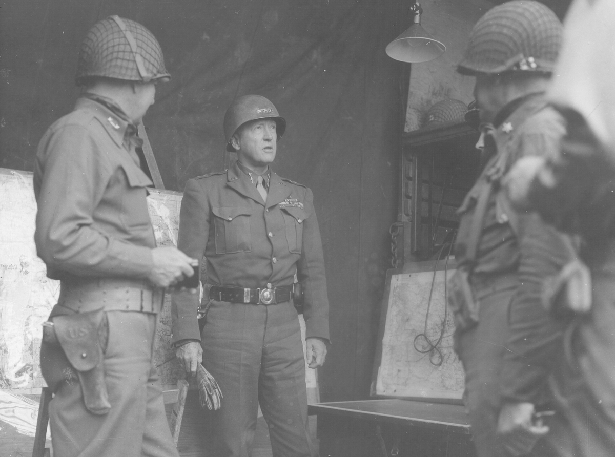 PattonOwn's tweet photo. A Day with General Patton!

The cameras were still following Patton when he reached the next headquarters.

What he saw immediately put him in a foul mood!

On August 26, 1944, Patton arrived at the headquarters of Major General Lindsay McDonald Silvester’s 7th Armored Division.

The division had landed in Normandy only two weeks earlier. It had already fought through Chartres and crossed the Seine at Melun, but its progress eastward was slower than Patton expected.

He also noticed armored infantrymen struggling beneath too much equipment. Patton told Silvester bluntly that his division looked terrible and that its progress was unsatisfactory. He demanded immediate improvement.

It was classic Patton: appearances reflected discipline, unnecessary equipment reduced mobility, and an armored division that stopped moving surrendered its greatest advantage.

The message was received.

Two days later, the 7th Armored Division spearheaded XX Corps’ drive toward Reims. By August 31, its tanks had reached Verdun and crossed the Meuse.

Another moment from August 26, 1944, "A Day with General Patton."