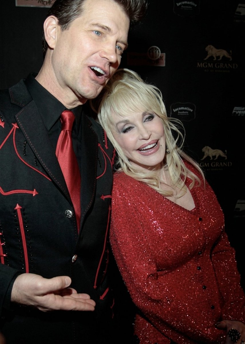 ChrisIsaak's tweet photo. I’m saddened to hear Dolly’s gone. Every time I saw her she seemed so positive and full of energy. In person she was gracious and gorgeous. I remember doing a Kenny Rogers special with Dolly. There was a moment when she and I were backstage. I asked her if she could tell me if a story I heard was true and she said OK. I said I’d heard that she once bought Porter Wagoner‘s song catalog when he was on hard times and a few years later, Porter asked if he could buy his songs back. She said no, she wouldn’t sell him back his songs but would give him back his songs. I asked if that was true. She said yes and nothing more. I think she didn’t like to speak of her good deeds, but being a songwriter, knowing how much songs mean to a writer, it made me have great respect for her. God bless her.