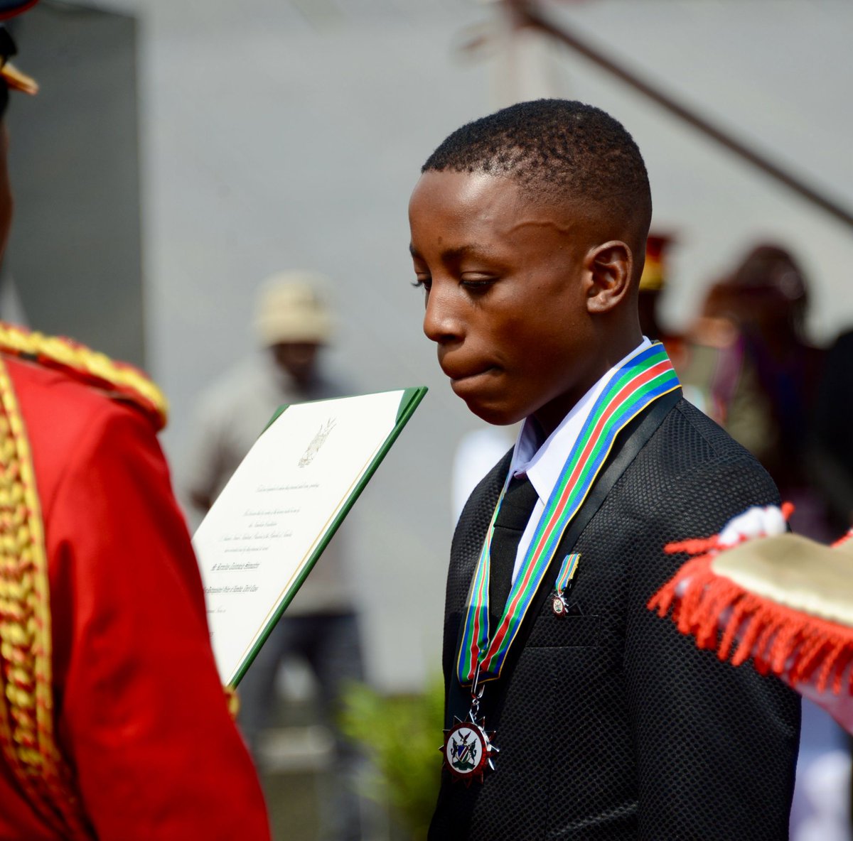 EagleFMNam's tweet photo. 16-Year-Old Shimuwaafeni Honoured as Hero

Sixteen-year-old Cornelius Tulotokela Shimuwaafeni of Omutundungu village in the Omusati Region has been conferred Hero Status by President Netumbo Nandi-Ndaitwah for saving the lives of nine-month-old twins.

Shimuwaafeni rescued the twins after they were thrown into a water pond on 17 May 2026, risking his own life in the process.

The citation read during the 60th commemoration of Heroes Day said Cornelius acted without hesitation, cameras or the expectation of recognition or reward. He saw lives in danger and acted.

When asked what he would have done if the children were going to die, Cornelius reportedly answered: “I was going to die with them.”

Ndaitwah highlighted his actions as an example of true heroism and challenged Namibians to reflect on who is a hero in today’s Namibia.

The recognition comes with an award of N$200,000. Minister of Finance, Ericah Shafudah, said the government is in discussions to establish a trust for Cornelius.

Dignitaries attending the Heroes Day ceremony also donated money to the young hero in recognition of his bravery and selfless act.

Report: Annakleta Haikera
Photos: Hee-Dee Walenga