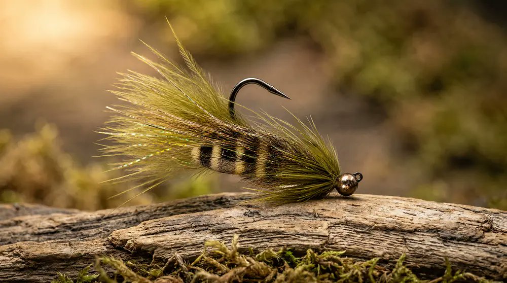 Saltwateronfly's tweet photo. Jig hook + soft hackle = the buggiest little baitfish you'll fish this fall.

Built this one on the Partridge Ideal Jig SUJ — 60° bend, wide gape, black nickel, barbless. That in-line eye and jig bend means it rides hook-point-up on a slotted tungsten bead, so it's shrugging off bottom snags instead of getting wedged under a ledge.

For the imitator (my take on the Sugar Momma):

🪶 Ewing Marabou Body feathers for the collar — moves like nothing else in the water
🪶 Chickabou for a second collar of fine, breathing marabou-like fibers
🪶 Hen cape for a natural wing profile
🪶 Mallard flank as the first collar for that mottled, buggy pulse

Stack those materials right and you've got a jig streamer that breathes on the dead drift and swims on the strip. This is why I build around this hook — the gape gives you real hook-setting room, and the surehold point stays sharp fish after fish.

Tie your own 👉 Grab the Partridge Ideal Jig SUJ hooks and the Ewing Hackle (Marabou Body, Chickabou, Hen Cape) at https://t.co/7m5q2leZZr — link: https://t.co/tWs4xJpkhc