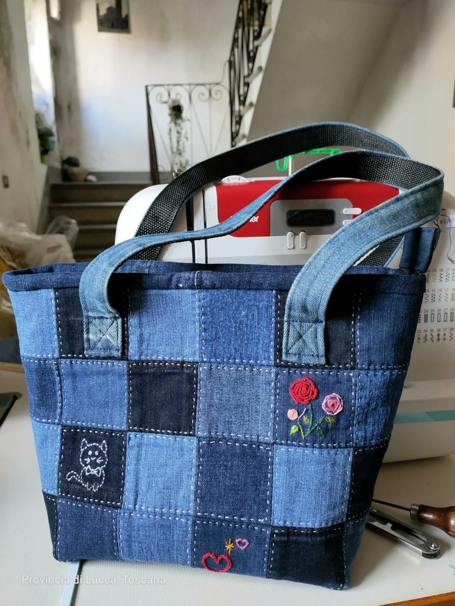 PortadorDylan's tweet photo. Just upcycled an old denim jacket into a custom patchwork tote!  No fancy tools needed, just some basic stitches and a love for zero-waste vibes. #DIYCraft #Upcycle https://t.co/ncX5BshEBB