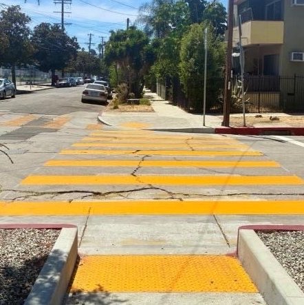 kane's tweet photo. Peak California governance is bragging about taking a year to paint a crosswalk without bothering to fix the giant cracks. https://t.co/tH8EEjd203