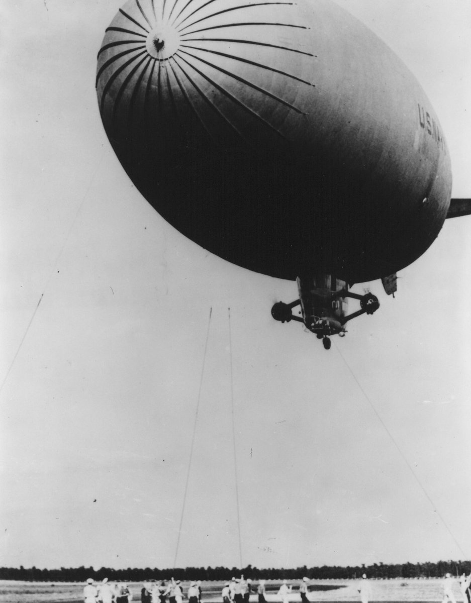 FLETC's tweet photo. #ThrowbackThursday: Before training law enforcement, #FLETC-Glynco was the Glynco Naval Air Station. During WWII, U.S. Navy blimps flew from giant wooden hangars to patrol the East Coast for U-boats. Today, that same spirit of vigilance and service guides our mission. ✈️ https://t.co/3ndBWHwI8h