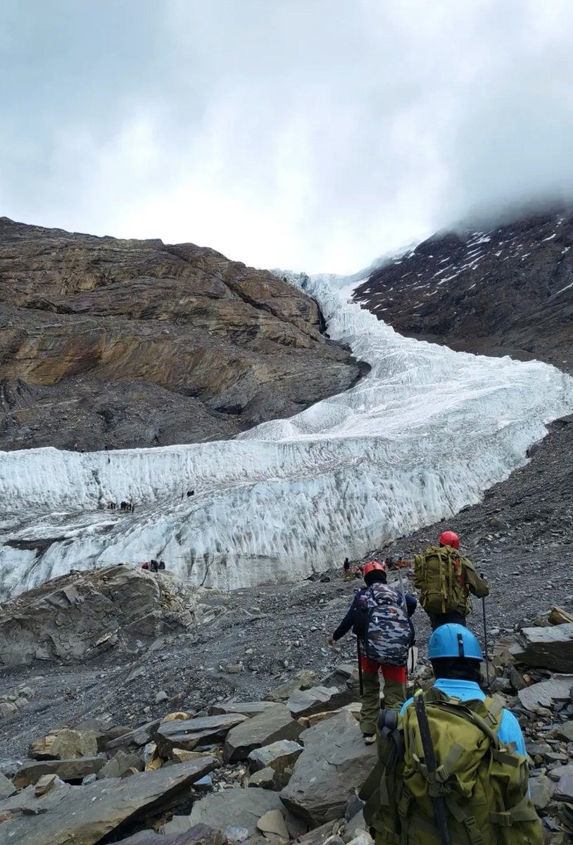 HeyItsMegha's tweet photo. Most of us have no idea how BIG a glacier actually is.

Look closely at the left side of this photo.

Those tiny black dots are people standing on the glacier.

This is the Meerathang glacier in Arunachal Pradesh, India in summer . 

When I first saw it, I thought of a glacier as a huge piece of ice sitting somewhere on a mountain.

But seeing humans next to it completely changes the scale.

That “tiny” glacier is massive.

And after the recent disaster in Nepal, it makes you realise how much water and ice the Himalayas are holding above us.

How big did you think a glacier was before seeing this?