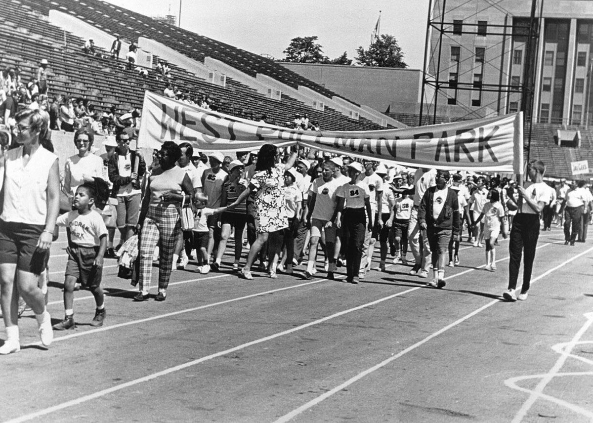 50YearsAgoLive's tweet photo. At the Seattle Special Olympics nine contestants, all physically or mentally disabled, start the 100-yard dash, but one little boy stumbles on the asphalt at the starting gun and begins to cry. 

The rest of the competitors abandon their ambitions of reaching the finish line first and double back to lift up the little boy, and then all nine link arms and walk together to the finish line, where they receive a standing ovation.