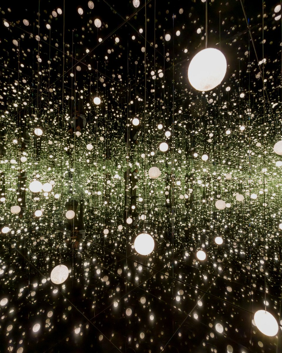 Guggenheim's tweet photo. For seventy years she turned obsession into infinity — the dots, the pumpkins, the mirrored rooms that dissolve the wall between a person and the universe. 

Yayoi Kusama broke through frontiers no one had mapped, and she changed the history of avant-garde art along the way.

We are so grateful for Kusama's work, for her belief in love and peace, & for a relationship with the Guggenheim that spanned much of her life. 

Significant works live on in our collections in New York, Bilbao, and Abu Dhabi, including her INFINITY MIRRORED ROOM — DANCING LIGHTS THAT FLEW UP TO THE UNIVERSE (2019) currently on view in "Guggenheim Pop: 1960–Now." 
 
Our deepest condolences to her family, her friends, her colleagues, and to everyone who found something of themselves in her work.

Images: (1) Kusama creating for the "My Eternal Soul" series in her studio
2014, Yayoi Kusama Museum. (2) Installation view, "Guggenheim Pop: 1960 to Now." David Heald.