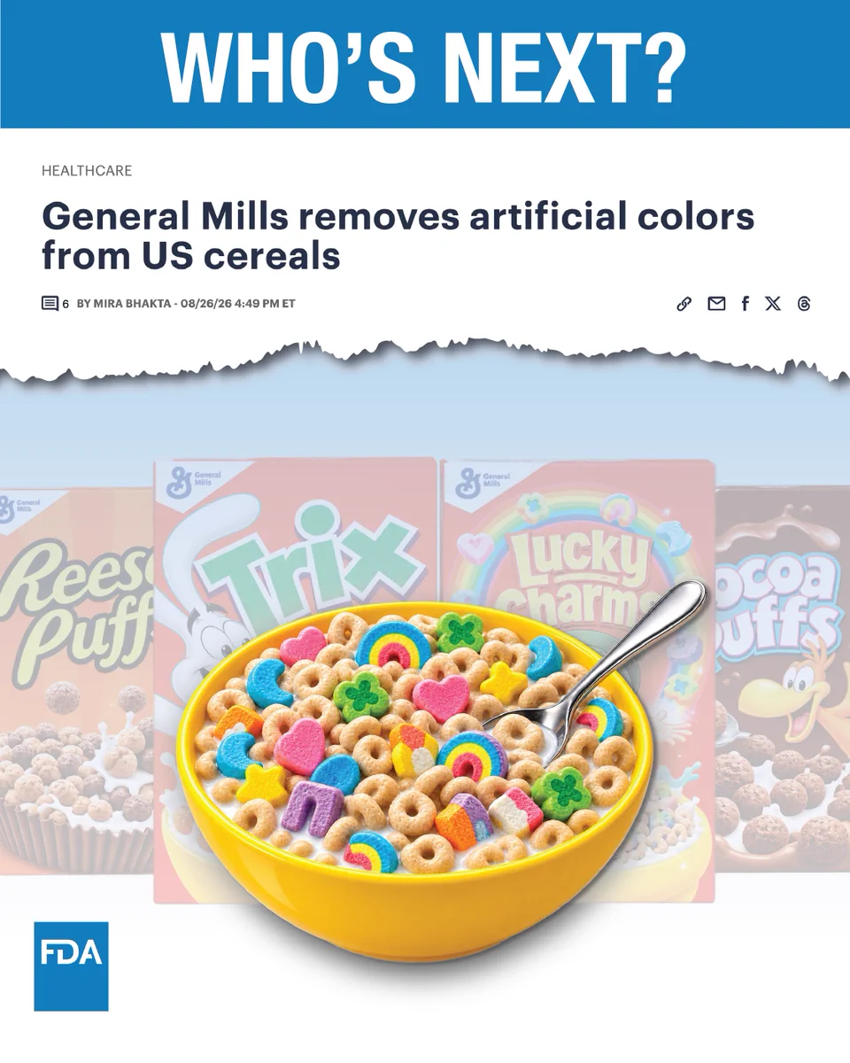 A graphic with a blue header reading "WHO'S NEXT?" in bold white text. Below, a news article headline reads "General Mills removes artificial colors from US cereals," bylined by Mira Bhakta on 08/26/26. The image features a yellow bowl filled with Lucky Charms cereal and colorful marshmallow shapes in milk. In the background are partially visible cereal boxes including Reese's Puffs, Trix, Lucky Charms, and Cocoa Puffs. An FDA logo appears in the lower left corner.