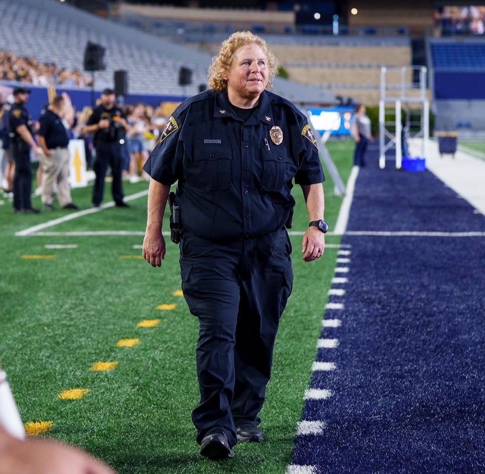 CopTalkLIVE's tweet photo. West Virginia University Police Chief Sherry St. Clair and that fresh, “I’m not over this weekend’s bender” look. 

If shit rolls down hill, her officers must look like the bottom of an elephant stall. https://t.co/W3gxHMq5LU