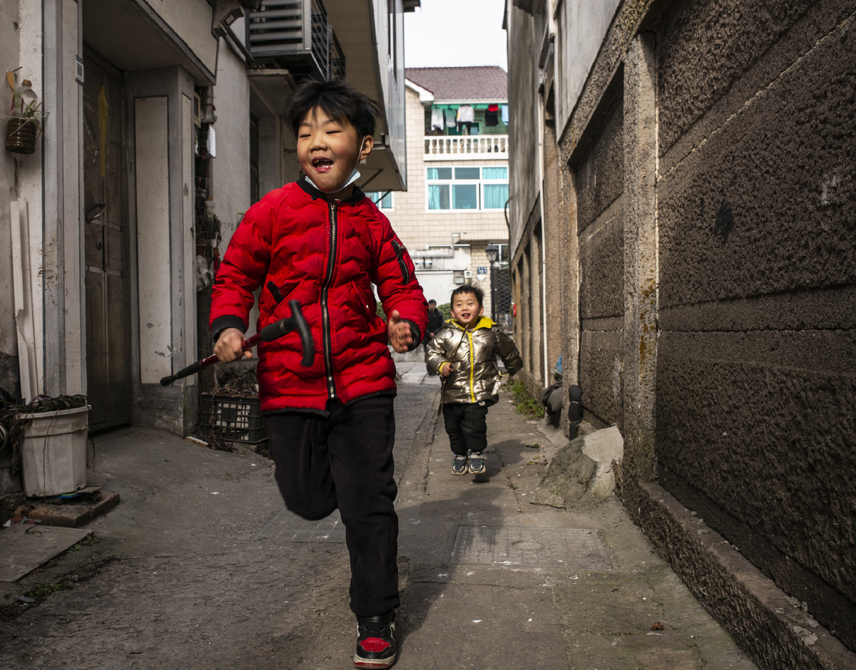 PKhan577's tweet photo. Quick street snap: a kid chasing a stray cat down the alley at golden hour, pure unscripted magic. https://t.co/jvjHQnZstC