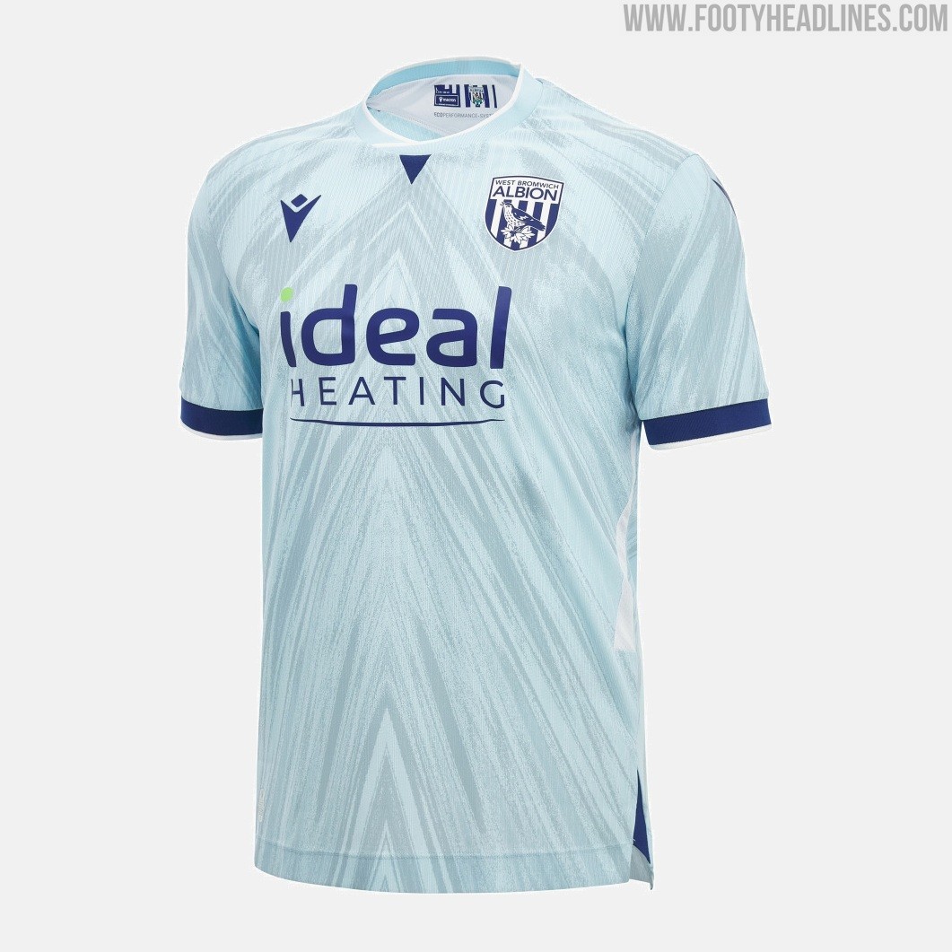 Footy_Headlines's tweet photo. 𝙒𝙚𝙨𝙩 𝘽𝙧𝙤𝙢𝙬𝙞𝙘𝙝 𝘼𝙡𝙗𝙞𝙤𝙣 𝟐𝟔-𝟐𝟕 𝙏𝙝𝙞𝙧𝙙 𝙆𝙞𝙩 𝙍𝙚𝙡𝙚𝙖𝙨𝙚𝙙

Completing their kit lineup for the new season, West Bromwich Albion and technical partner Macron have officially unveiled the club's new third strip for the 2026-27 campaign.

The Macron West Bromwich Albion 2026-27 third jersey introduces a fresh color palette, featuring a light pastel blue base adorned with a tonal, abstract spray-effect graphic that subtly incorporates the letter 'A' for Albion across the entire front and sleeves. 

Contrasting navy blue accents highlight the collar insert, sleeve cuffs, and side details, all finished with fine white trim. White Eco Mesh side panels enhance breathability and add color contrast.