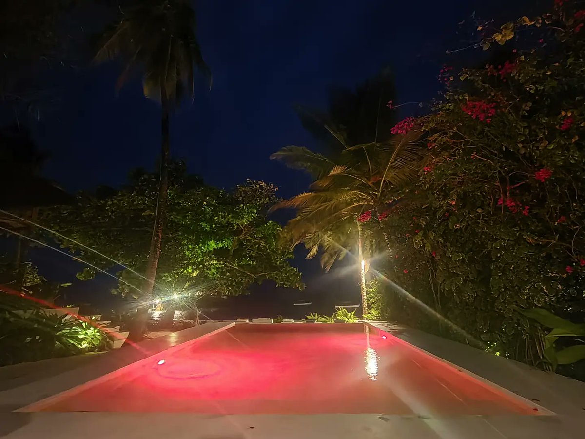 emine_mert's tweet photo. The pool’s vibrant colors at night at Upendo Beach are beautiful. https://t.co/dbg1VGnxNJ
