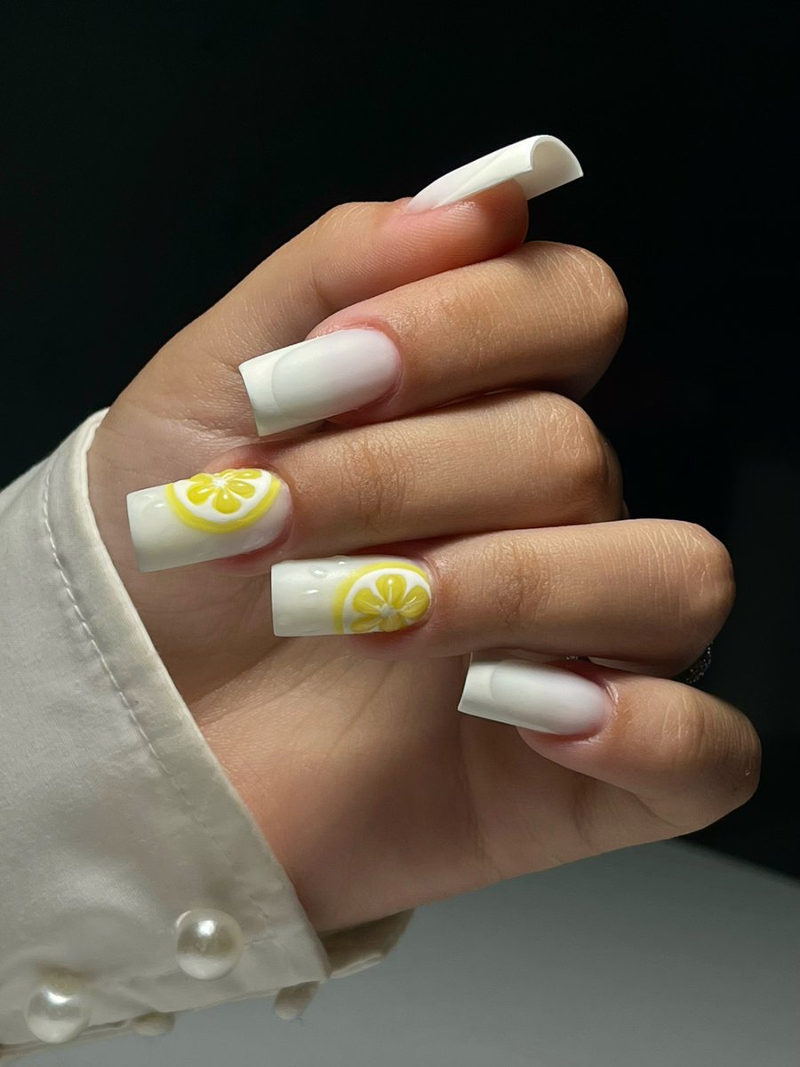 DanetteLucek's tweet photo. When life gives me lemons, I make lemoNAILS. Manicure created with Fiber Milky White gel by TL Nail System, finished with hand-painted details for extra personality. https://t.co/VUu1plPmTZ