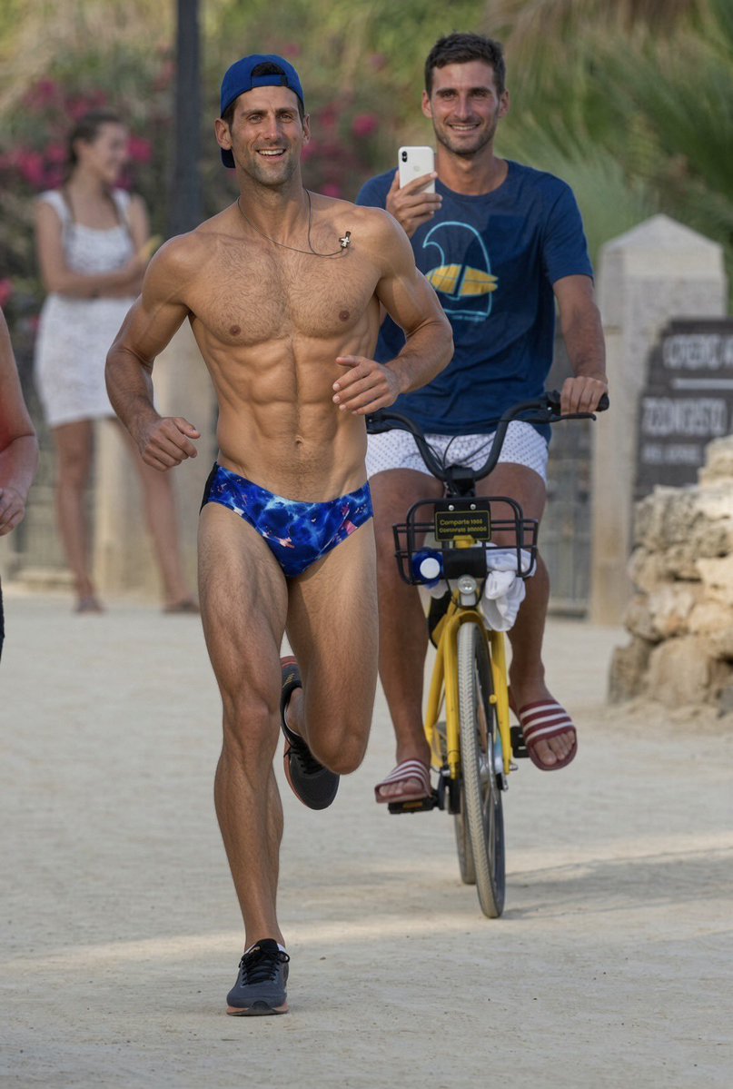Emmy_jay231's tweet photo. Professional Tennis player Novak Djokovic running shirtless along an outdoor path in Marbella, Spain. https://t.co/lm8Q1ZhVmX