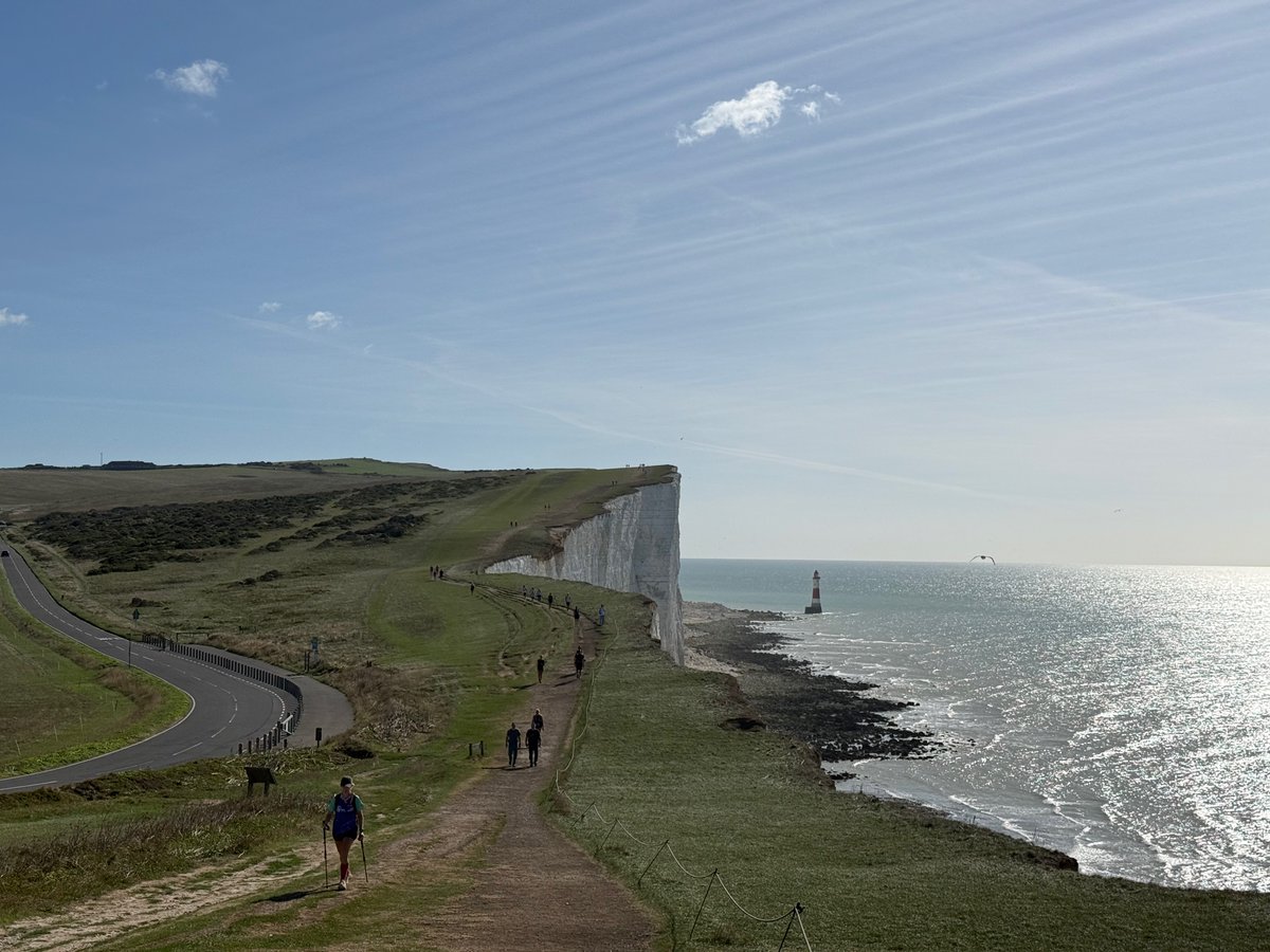 UKRunChat's tweet photo. Thousands of Ultra Challengers took on the spectacular South Coast Ultra Challenge last weekend, raising more than £600,000 for charities.

Walkers, joggers and runners descended on Sussex from across the country for the annual event, setting off from Bramley Camping Park near Eastbourne and taking on distances of 25km, 57km and the full 100km route through the South Downs National Park.

The 100km Challenge saw participants tackle the dramatic climb to Beachy Head, cross the famous Seven Sisters, pass through Brighton and Hove, and continue across the South Downs before finishing beneath Arundel Castle.

While many participants took part to test themselves physically, the event also brought together hundreds of people fundraising in memory of loved ones, supporting charities close to their hearts and raising awareness of important causes.

Among them were Brighton couple Matt and Nicki Spiers, who completed the 100km challenge in memory of their daughter, Issy, who died earlier this year aged 13 after living with a brain tumour for almost four years. Joined by their son Jamie and a large group of family and friends, the team walked every step to support The Brain Tumour Charity, raising tens of thousands of pounds in Issy’s memory.

Also among the 100km finishers was Toby Freeman, founder of The Robin Cancer Trust, who ran his first-ever 100km ultra challenge as the final chapter of his long-running Big Ballsy Challenge. Toby has spent years raising awareness of testicular cancer through a series of endurance events while dressed as a giant testicle, helping spark life-saving conversations around one of the most common cancers affecting young men. 

Elsewhere, David Radcliffe completed the challenge in memory of his son George, who died in 2023 following a battle with rhabdomyosarcoma, a rare childhood cancer.

David took on the 100km route to raise funds for Just George, a campaign supporting childhood cancer research through CCLG: The Children & Young People’s Cancer Association.
The event featured a 25km route along the Sussex coast, a 57km challenge finishing at Hove Park, and the flagship 100km distance which continued on to Arundel.

Ultra Challenge’s Nicola Smith said: “The South Coast Ultra Challenge continues to go from strength to strength and it’s fantastic to, yet again, see so many taking part this year.

“The combination of the South Downs, the Seven Sisters, Beachy Head and the Sussex coastline creates one of the most iconic and spectacular challenge routes anywhere in the UK, and that’s a huge part of why so many people return year after year.

“What makes the event truly special, however, is the incredible fundraising and personal stories behind every participant. To see more than £600,000 raised for around 150 charities is a remarkable achievement and demonstrates the extraordinary generosity, determination and community spirit of everyone who took part.

“Whether they completed 25km, 57km or the full 100km challenge, every participant should be incredibly proud of what they’ve achieved.”

From first-time challengers to experienced ultra-distance athletes, thousands celebrated personal achievements across the weekend, making the 2026 South Coast Ultra Challenge another memorable event for Sussex and for the many charities set to benefit from the funds raised.