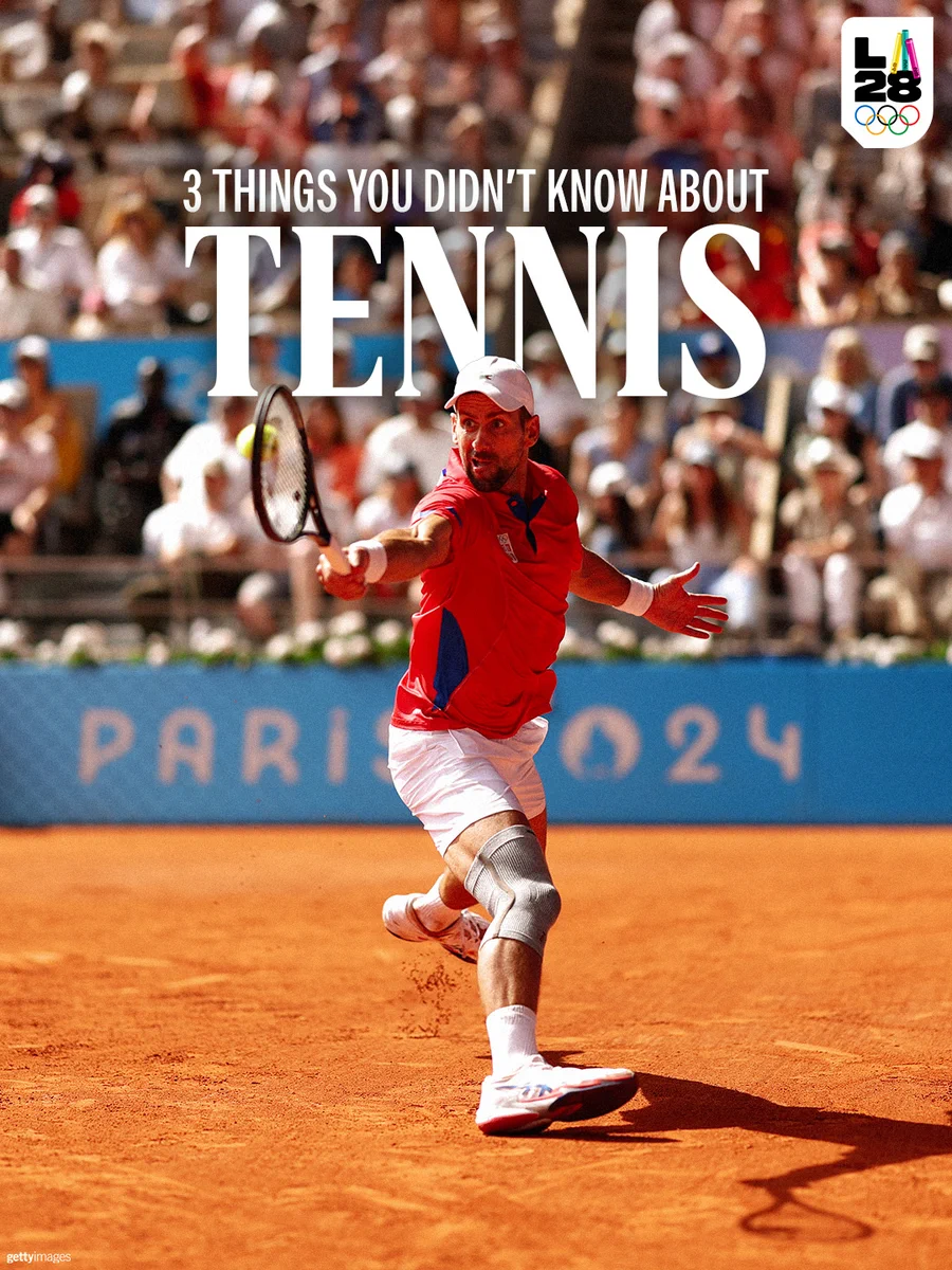 Olympic tennis player, Novak Djokovic is in a red shirt and white shorts hits a forehand on a clay court during a match. White text overlay reads, "3 things you didn't know about Tennis." The LA28 logo is in the top right corner.