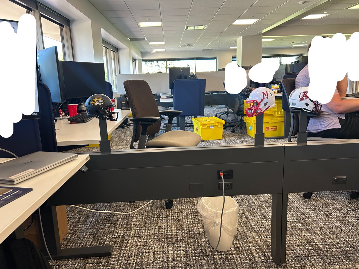 derekhuffington's tweet photo. Classic big 12 match up on the desk divider poles https://t.co/0A2DDOd95E