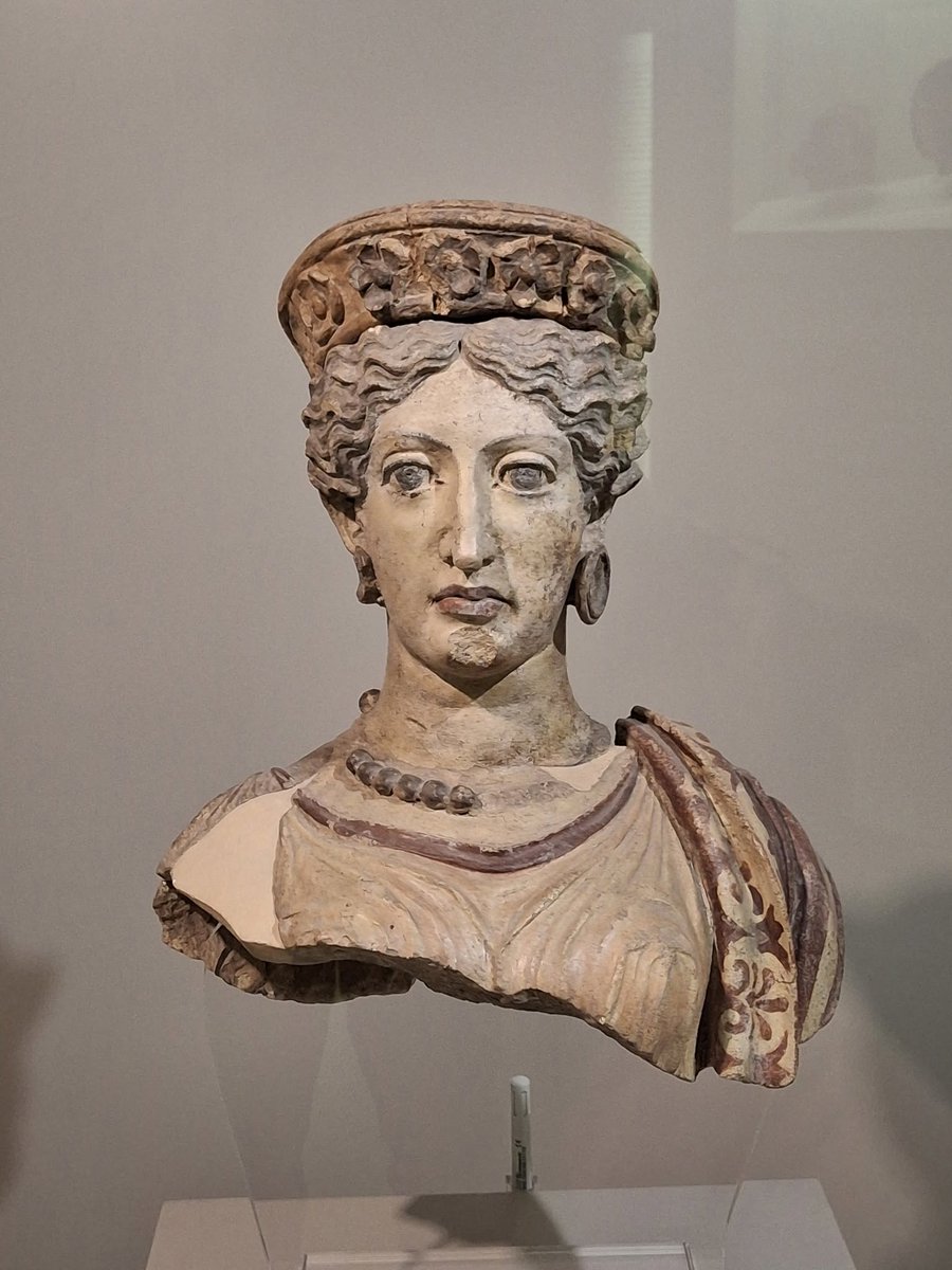 ClassicalWisdom's tweet photo. A terracotta bust of a goddess from Falerii Veteres, modern Civita Castellana, dating to around 380 BC. Her elaborate diadem, finely folded peplos, and traces of original paint offer a vivid glimpse into the religious art of ancient Italy. #AncientRome #AncientArt https://t.co/MbjrPAd1Zy