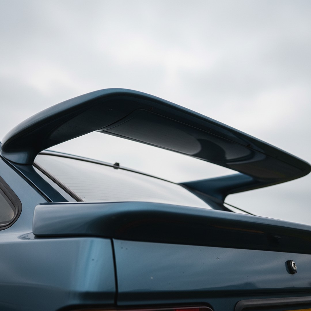 brianharri25730's tweet photo. Can you name this car? Check out that iconic rear wing and sleek blue finish—a classic from the era of bold designs and turbocharged dreams. Drop your guess below! https://t.co/7TTBpPe8VW