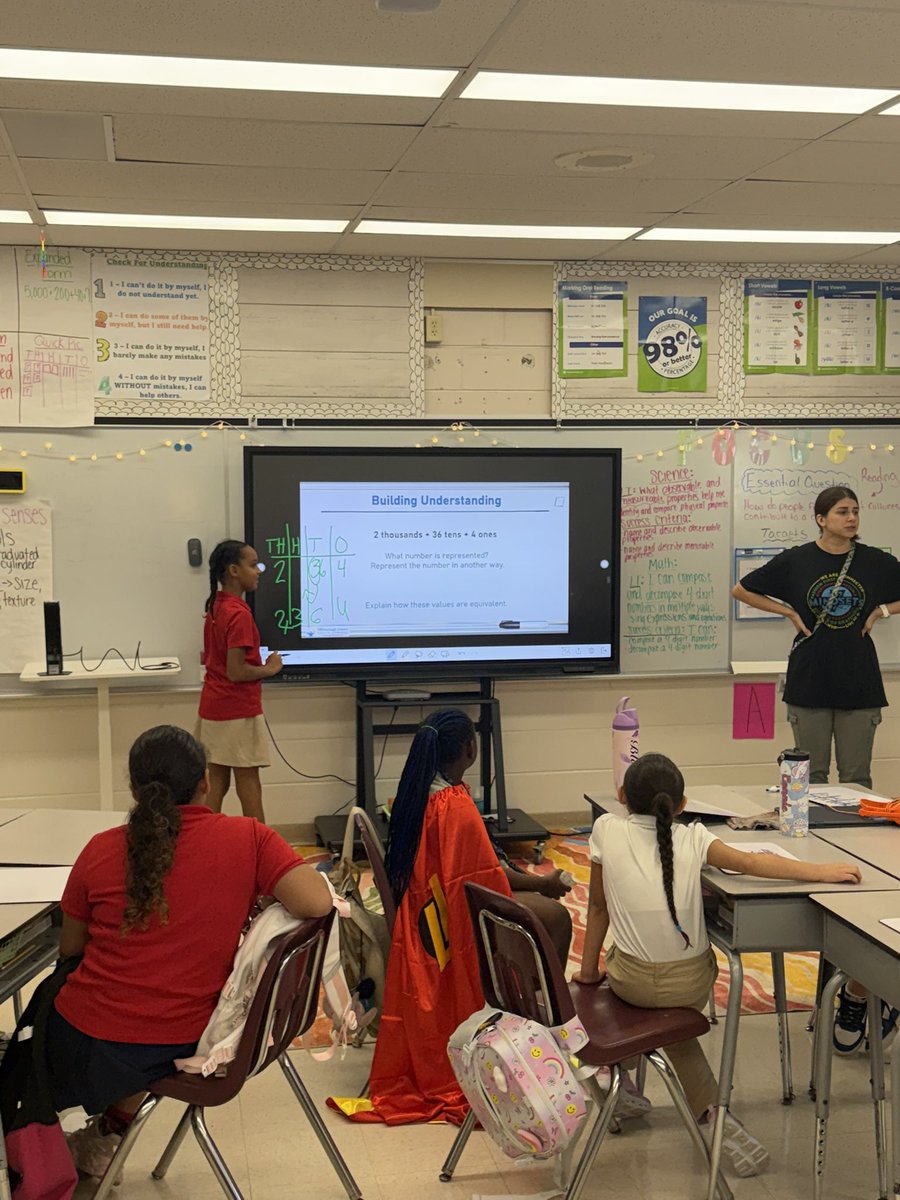 THEShawElem's tweet photo. 📚➕ Math Learning in Action at Shaw! ➕📚 Ms. Mesa is engaging our 3rd-grade mathematicians in composing and decomposing 4-digit numbers using place value! 🔢🐾 Purposeful teaching + engaged students = academic ownership in action! ❤️💙
#ShawSome #MathInAction #AcademicOwnership https://t.co/HkGVDHD2bO