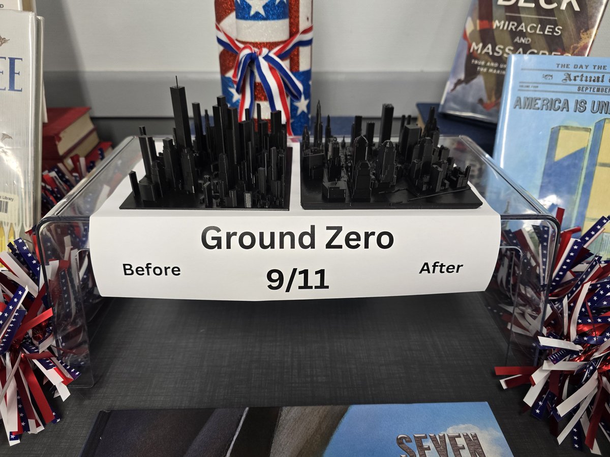 notthatMrsC's tweet photo. Today at work, I set up a very special display. Tomorrow marks the 25th anniversary of the worst tragedy to occur on American soil. 
I will never forget how much American patriotism I wmitnessed after this terrorist attack. 9/11 brought us together.
#September112001 #NeverForget https://t.co/QNfQ8JW7Am