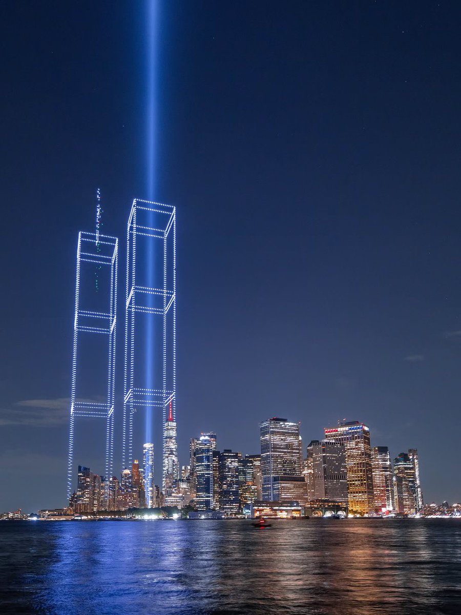 ScopeWorldX's tweet photo. A breathtaking night of remembrance in New York Harbor for the 25th Anniversary of 9/11 ✨ 🕊️ https://t.co/n3vpviNZus