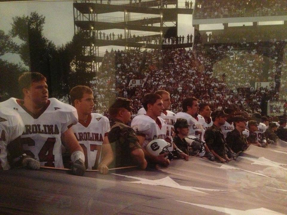 FamouslyGarnet's tweet photo. On September 20, 2001, #18 South Carolina faced #17 Mississippi State in the first game between two NCAA Division I teams played after 9/11.

Before kickoff, players from both teams came together and helped unfurl a massive American flag across the field. They locked arms during the national anthem. Players wiped tears from their eyes. Instead of two fan bases, for a few moments, it felt like everyone in the stadium was on the same team. The stadium, the college football world, unified as one.
