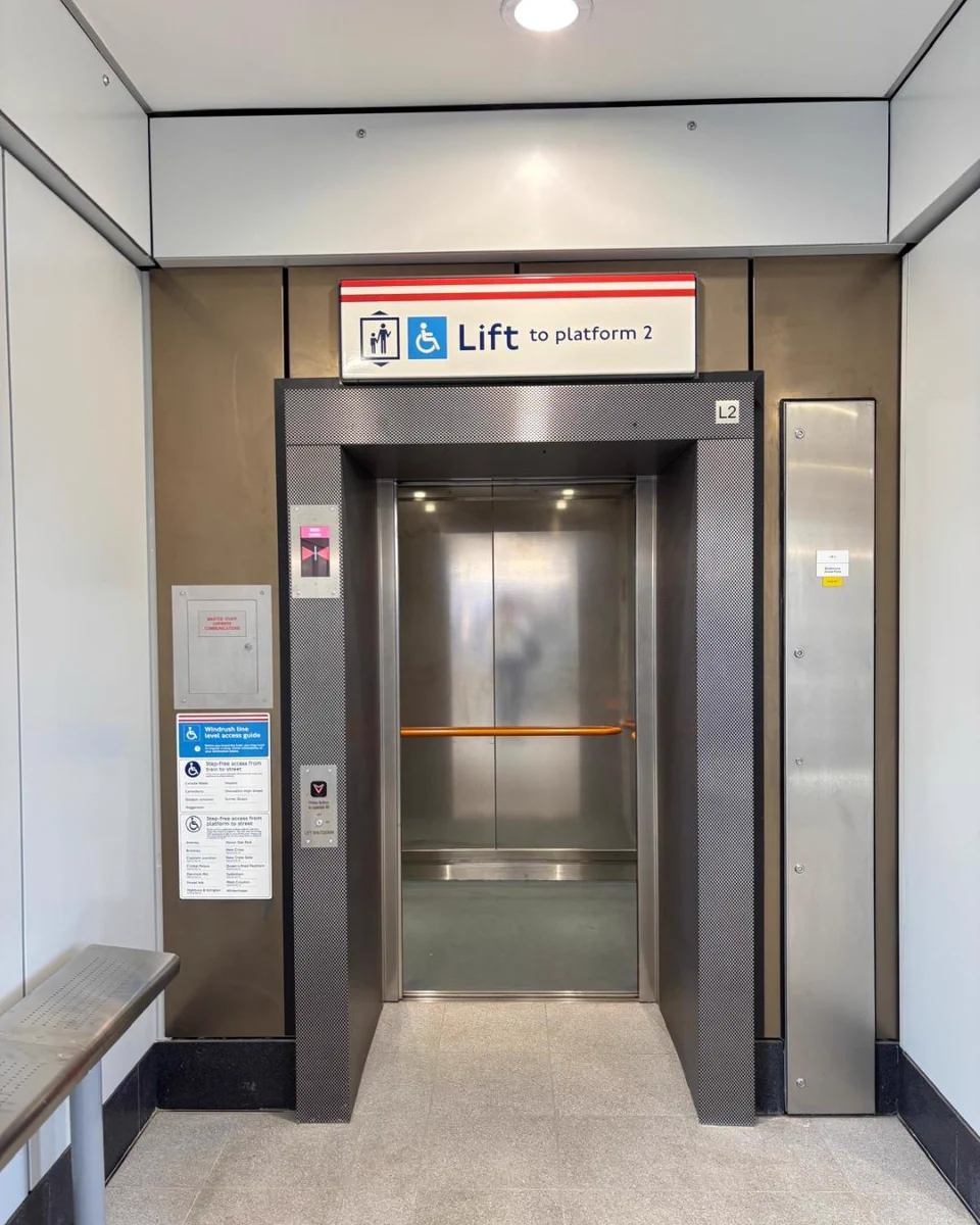 Interior lift at Surrey Quays station, with signage indicating the lift provides access to platform 2.