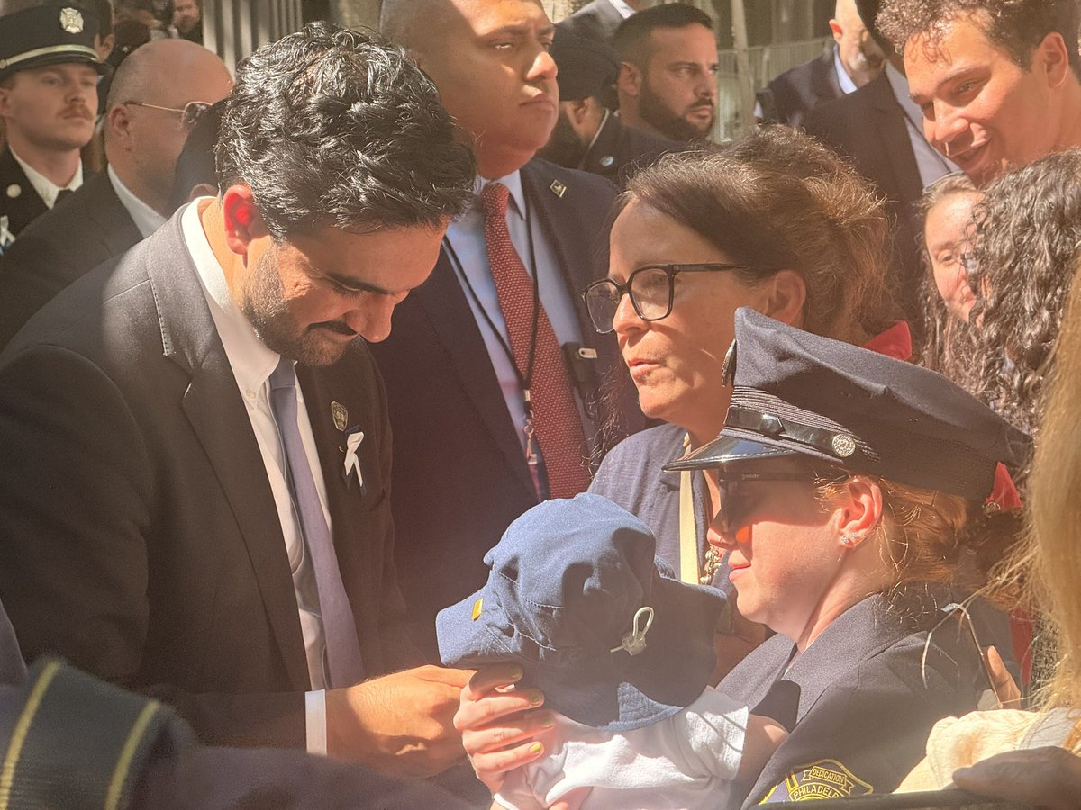 JohnAsbury's tweet photo. Mayor Mamdani is taking picture and hugging family members following today’s 9/11 ceremony https://t.co/aESH9dIDav