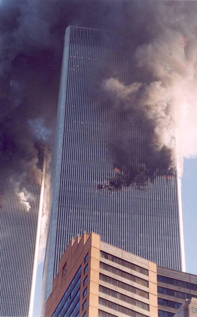 25YearsAgoLive's tweet photo. Montenegrin window washer Roko Camaj, who has worked at the World Trade Center since 1973, is trapped on the 105th floor of the burning South Tower. 

He radioes down with a walkie talkie to colleagues on the 22nd floor. 

They assure him that firefighters are coming up to rescue him, but he replies, “Don’t let no people up here. Big smoke!”