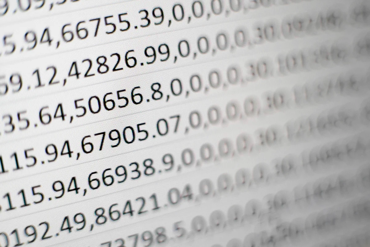 Photograph of printout of numbers. Credit goes to Mika Baumeister via Unsplash