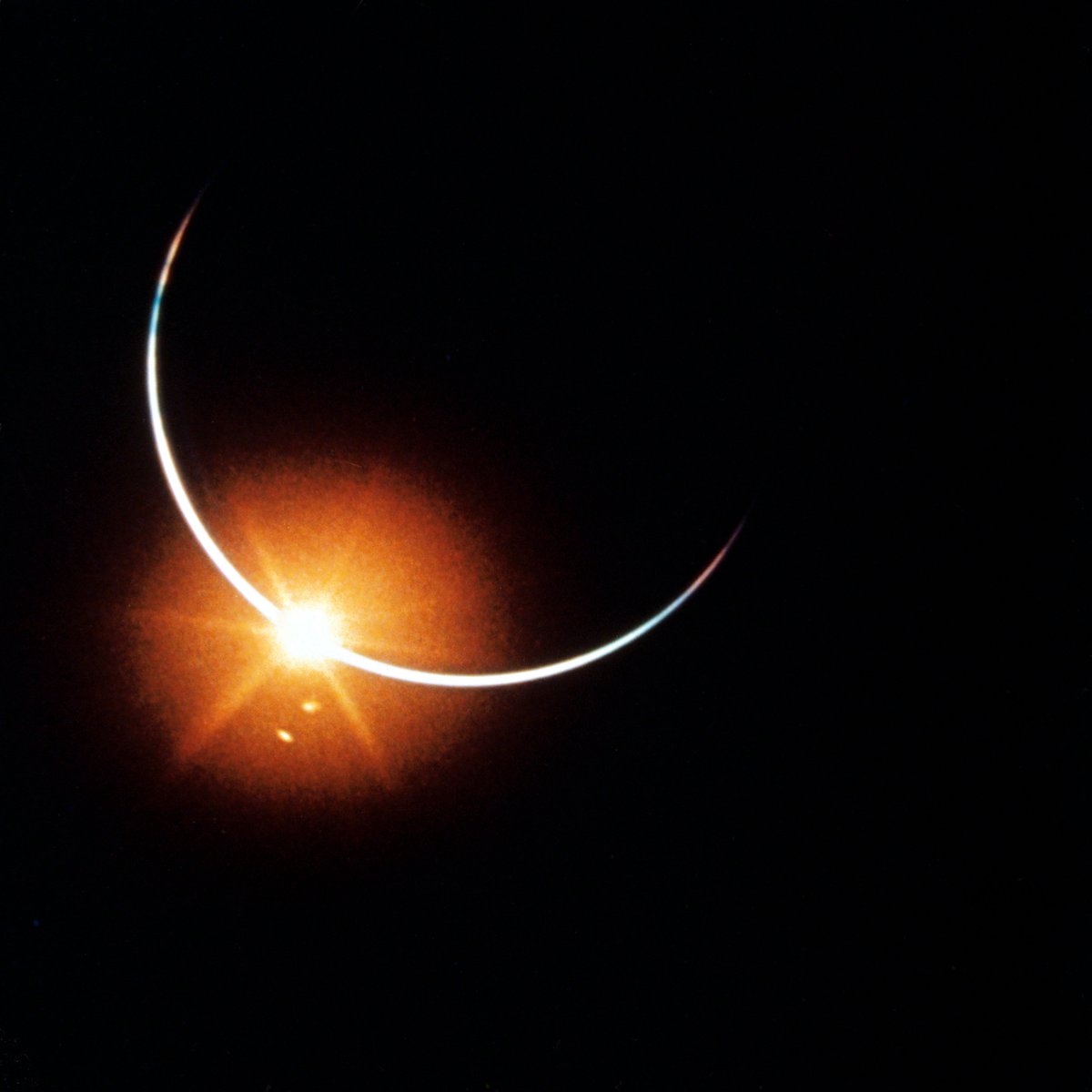 astro4pics's tweet photo. On 21 November 1969, Apollo 12 was already on the way home when Earth lined up between the spacecraft and the Sun. The crew photographed that eclipse from the command module. 

What you see is a dark circle with a bright rim. The circle is Earth, and the light around it is the Sun leaking past the atmosphere. This is not a lunar eclipse and not the usual solar eclipse from a backyard. The blue planet is the disk that covers the star.  

Conrad, Gordon and Bean had left lunar orbit and were on the transearth coast. For a short time the geometry was perfect: Moon behind them, Earth in front, Sun hidden.  

Hard not to picture the three of them at the window when it went dark like that. After the Moon, after launch and landing, home is suddenly a black coin with fire around it. I imagine someone just went quiet for a second, then reached for the camera.