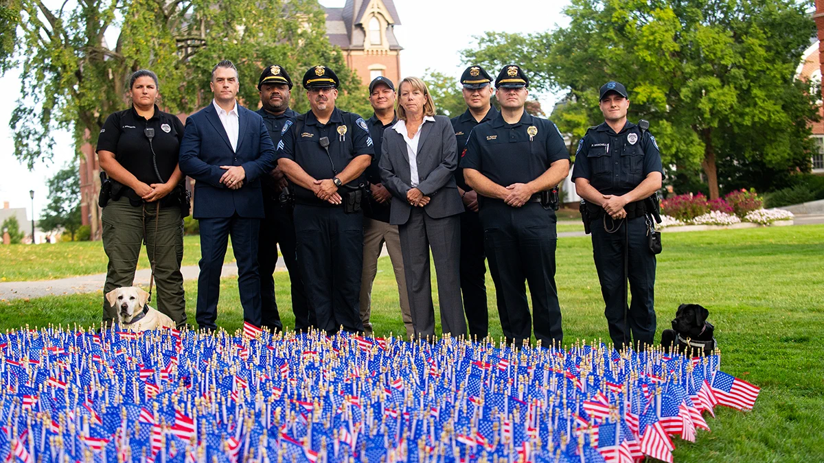Members of the Tufts University Police Department attend the 9/11 flag ceremony and moment of silence on the Academic Quad on September 11, 2026. Photo: Alonso Nichols/Tufts University. 
