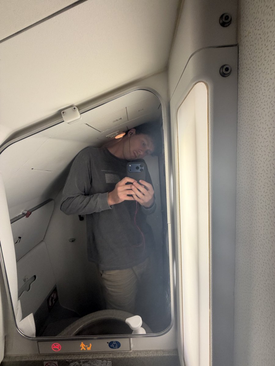 JulianAndreone's tweet photo. Legitimately astounded by airline companies’ greed at this point. It’s getting ridiculous — declining quality in every department and increasing costs across the board. (It has been proven that they deliberately decrease seat size, legroom, & overhead space year-to-year). 

@AmericanAir — What is this? I’m not 8 feet tall. I’m 6’5 & 192lbs and I can no longer fit in an economy seat or your lavaratories. 

We need a nationalized or publicly-owned airline, modeled after Amtrak, to introduce competition back into the market in quality and pricing. It’s the only way to incentivize these greedy executives to stop bleeding customers, who have no choice but to rely on these corporations for travel, dry for objectively awful experiences.