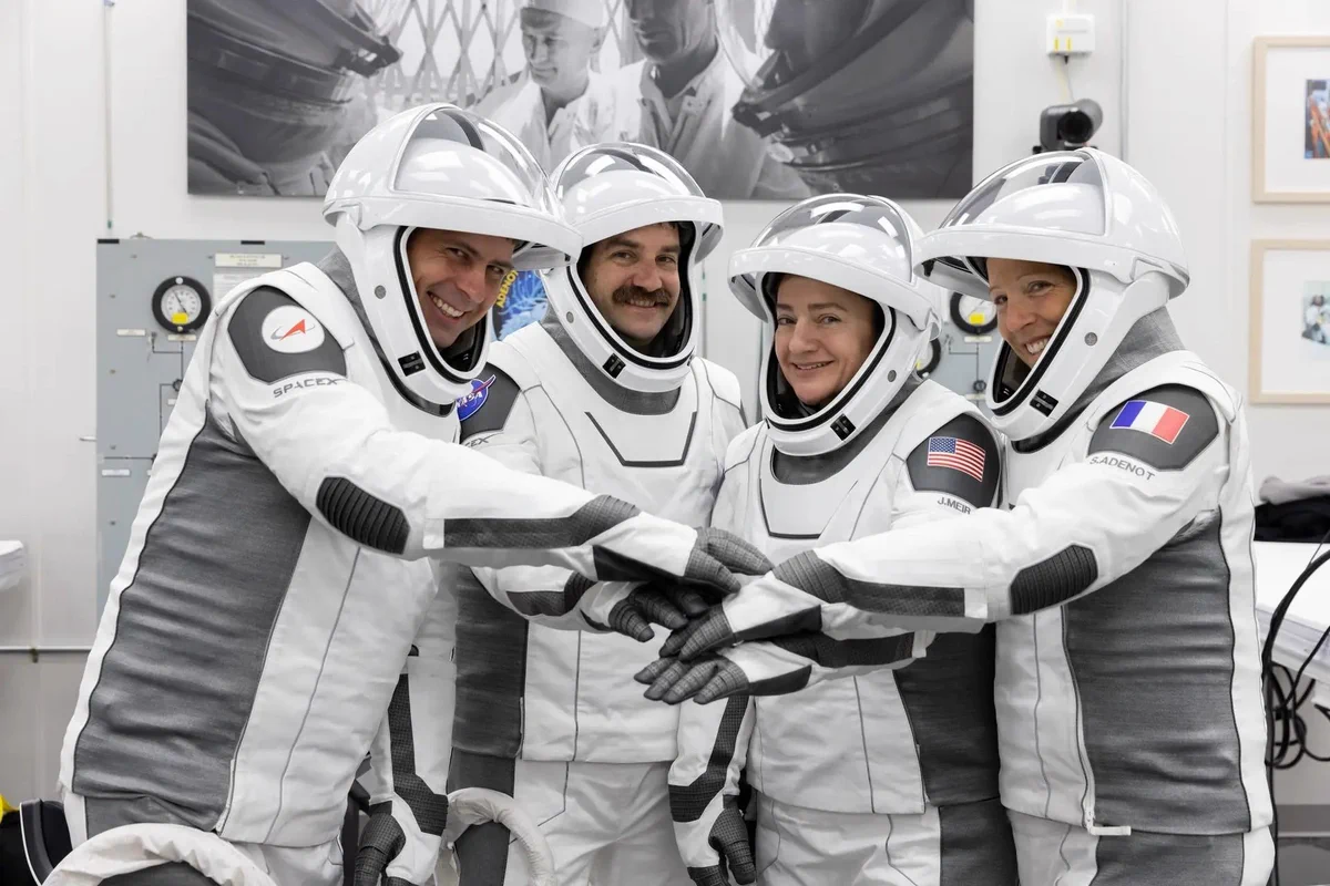 The four members of NASA’s SpaceX Crew-12 (from left: Roscosmos cosmonaut Andrey Fedyaev, NASA astronauts Jack Hathaway and Jessica Meir, and ESA (European Space Agency) astronaut Sophie Adenot) posing in white space suits. Credit: NASA/Kim Shiflett