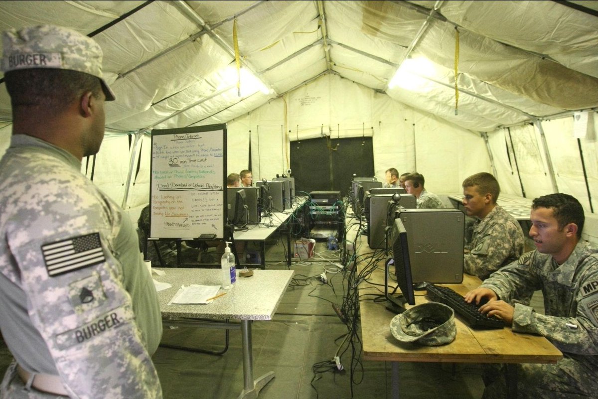 BlueCordCSM's tweet photo. Before Wi-Fi in your CHU, before FaceTime, before everyone carried a smartphone… There was the MWR INTERNET & PHONE CENTER. 

This was probably the most emotionally dangerous building on the entire FOB. 

You'd wait 45 minutes for a computer, log in, open Yahoo Mail, and then wait some more. 

And wait some more. "LOADING…" you'd finally get one email from home, only for the dude running the place to yell, “YOU GOT FIVE MINUTES LEFT!” 😂😂😂

And the phone booths were even better. You'd stand in line forever, clutching an AT&T calling card like it was classified material. Finally calling home:

“Hey, babe, it's me.”
3-second satellite delay.
“What?”
“I SAID IT'S ME.”
“What?”
“NEVER MIND.”

Meanwhile, somebody three booths down would be having the loudest deployment breakup in GWOT history, and 15 dudes in line would be pretending they couldn't hear every single word. 

And God help you if a COMMS BLACKOUT happened. Suddenly, everybody knew. Nobody asked questions.

If you experienced the early-GWOT internet café/phone center, you probably have a story to tell. 

👇 WHAT DO YOU REMEMBER ABOUT THESE PLACES?

@Boots_N_Chutes @DropzoneBrief