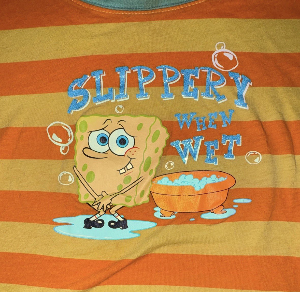 ArtofSpongeBob2's tweet photo. A SpongeBob “Slippery When Wet” shirt from the early 2000’s. https://t.co/lkTRj7eQyI