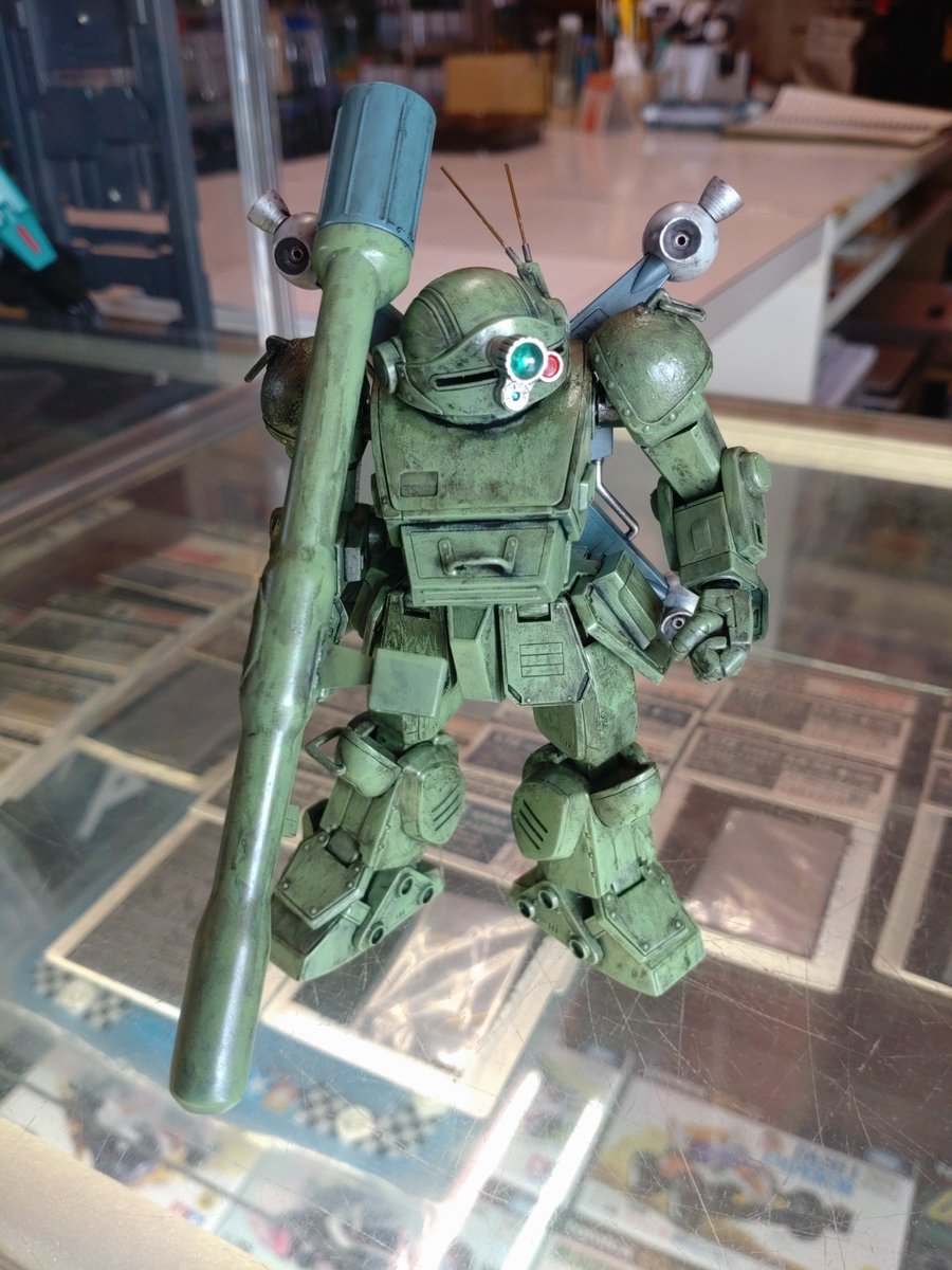 YujiK22072440's tweet photo. 無事に２週間遅れですが、明和模型さんのショーケースにスコープドッグを展示していただきました。そして約１年展示いただけました１/２４ストライクドッグをサルベージしました。 https://t.co/GypsIgsxPP