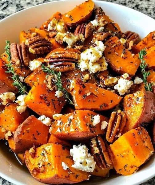 ann_ann886's tweet photo. Honey Roasted Sweet Potatoes with Feta and Pecans

Serves: 4-6 • Prep: 15 minutes • Roast: 30-35 minutes • Total: ~50 minutes

Ingredients
For the sweet potatoes
3 medium sweet potatoes, scrubbed and cut into thick chunks or wedges
2 tbsp olive oil
2 tbsp honey
1/2 tsp cinnamon
1/2 tsp smoked paprika
1/2 tsp dried thyme or Italian seasoning
1/2 tsp kosher salt
1/4 tsp black pepper
For the topping
1/2 cup pecans
1/3 cup crumbled feta
1-2 tsp fresh thyme leaves or chopped parsley
Extra drizzle of honey, for finishing
Pinch chili flakes, optional
Flaky salt, optional

Instructions
1. Prep the oven
Preheat oven to 425°F (220°C).
Line a large sheet pan or baking dish with parchment for easier cleanup.
2. Season the sweet potatoes
In a large bowl, toss the sweet potatoes with olive oil, honey, cinnamon, smoked paprika, thyme, salt, and black pepper until evenly coated.
3. Roast
Spread the sweet potatoes out in a single layer.
Roast for 25 minutes, then turn them gently.
Add the pecans to the pan for the last 8-10 minutes so they toast without burning.
Roast until the sweet potatoes are tender with caramelized edges and the pecans are fragrant.
4. Finish
Transfer everything to a serving bowl or platter.
While still warm, scatter over the feta.
Drizzle lightly with a little more honey.
Finish with fresh thyme, parsley, chili flakes if using, and a tiny pinch of flaky salt.

Tips
Don’t overcrowd the pan or the sweet potatoes will steam instead of roast.
Cut the pieces fairly evenly so they cook at the same rate.
Add the feta after roasting so it stays creamy and bright.
For extra depth, use hot honey instead of regular honey.

Easy variations
Add a splash of balsamic glaze for a more savory-sweet finish.
Swap feta for goat cheese.
Add dried cranberries or pomegranate seeds for a holiday-style version.
Use maple syrup instead of honey if you prefer.
Great with
Roast chicken
Grilled salmon
Holiday dinners
Grain bowls
A peppery green salad