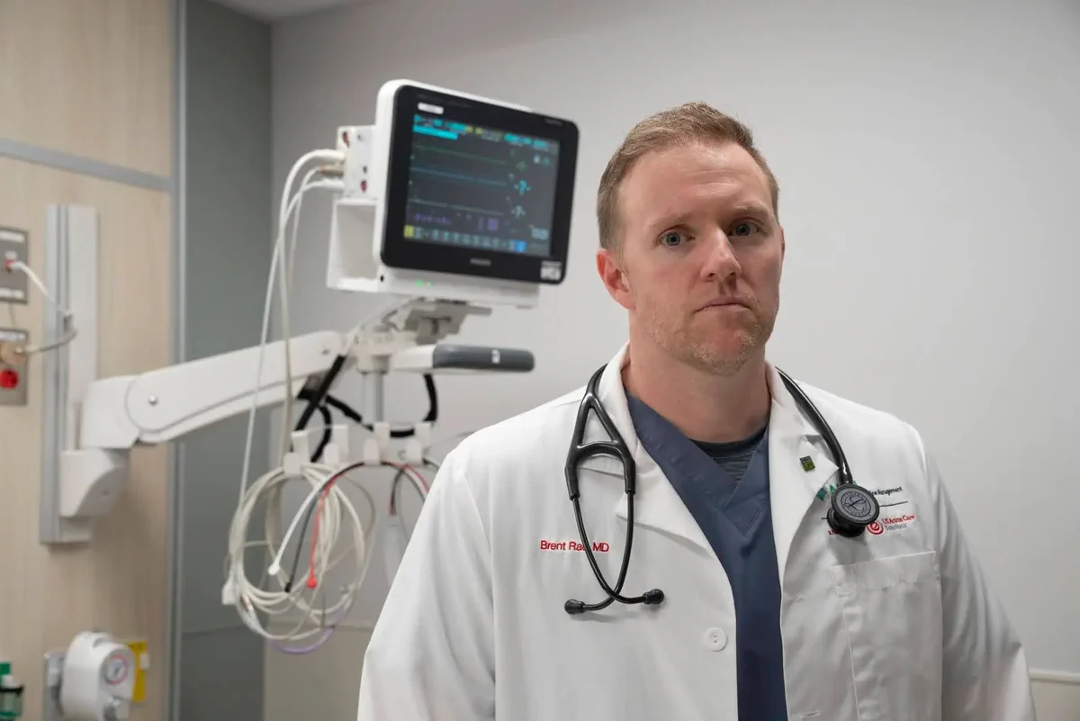 A doctor stands in front of a monitor in an ER. Photo used with permission from Public Source Pittsburgh