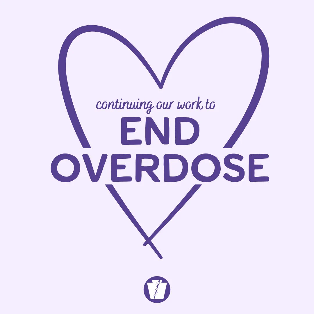 Purple heart outline with text inside reading 'continuing our work to END OVERDOSE' on a light background.