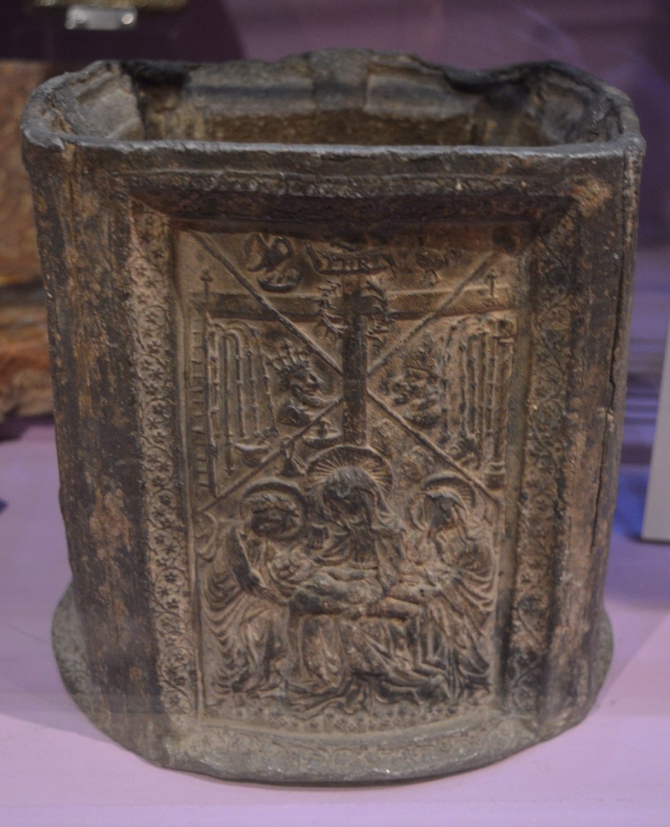 StBenedict21stC's tweet photo. This lead container, made about 1300, may have been a Holy Water stoup. The image appears to be the same on each side - it is commonly known as the Pieta, the taking of Jesus down from the cross and laying him in the arms of his mother. Gloucester Museum. https://t.co/9nULwSdv3u
