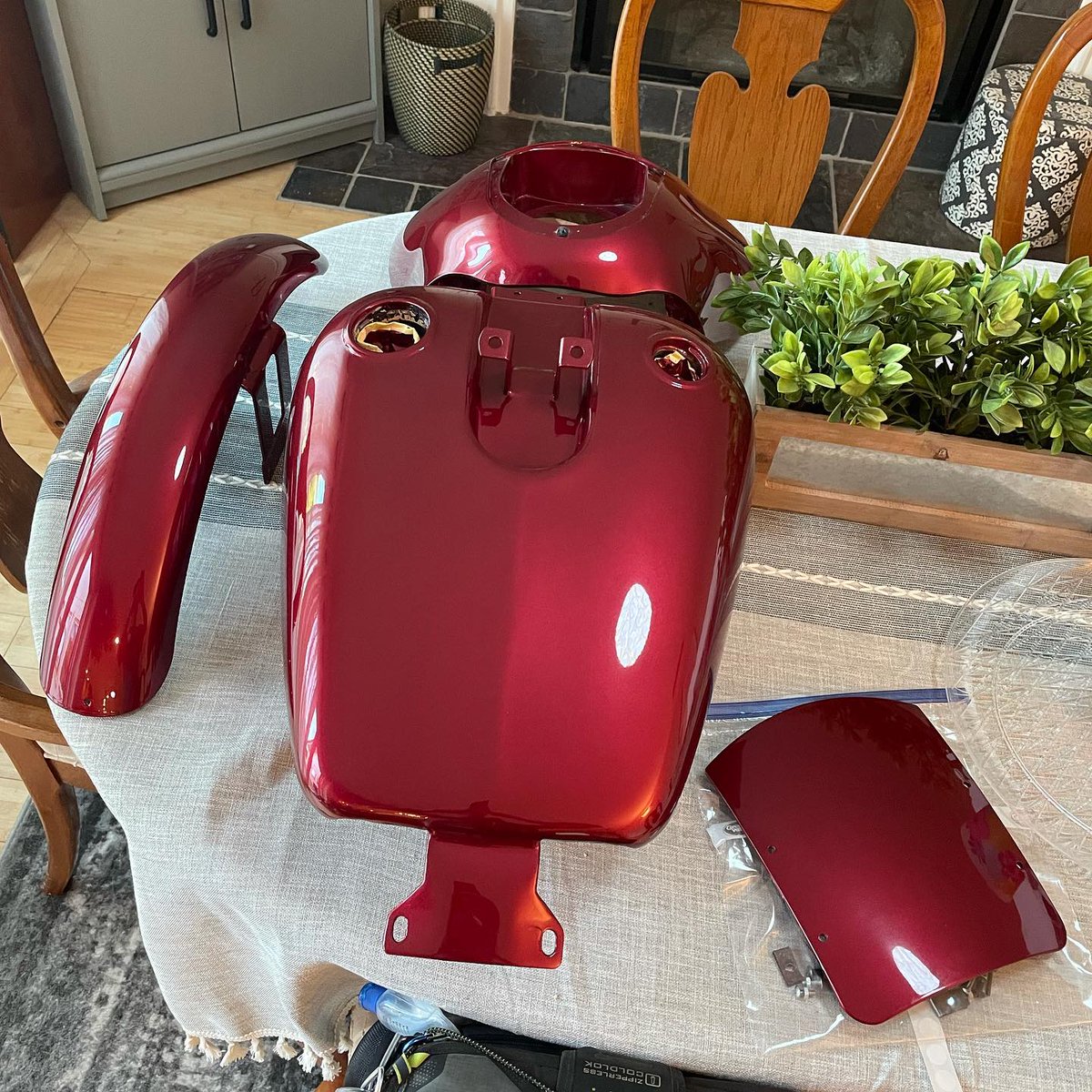 CandanceDufrane's tweet photo. How our dining room table looks 75% of the time: dinner is served. Here’s a glimpse of this project in progress—this Ruby Red piece has an incredible look in the sunlight. https://t.co/S1dk1fLGsk