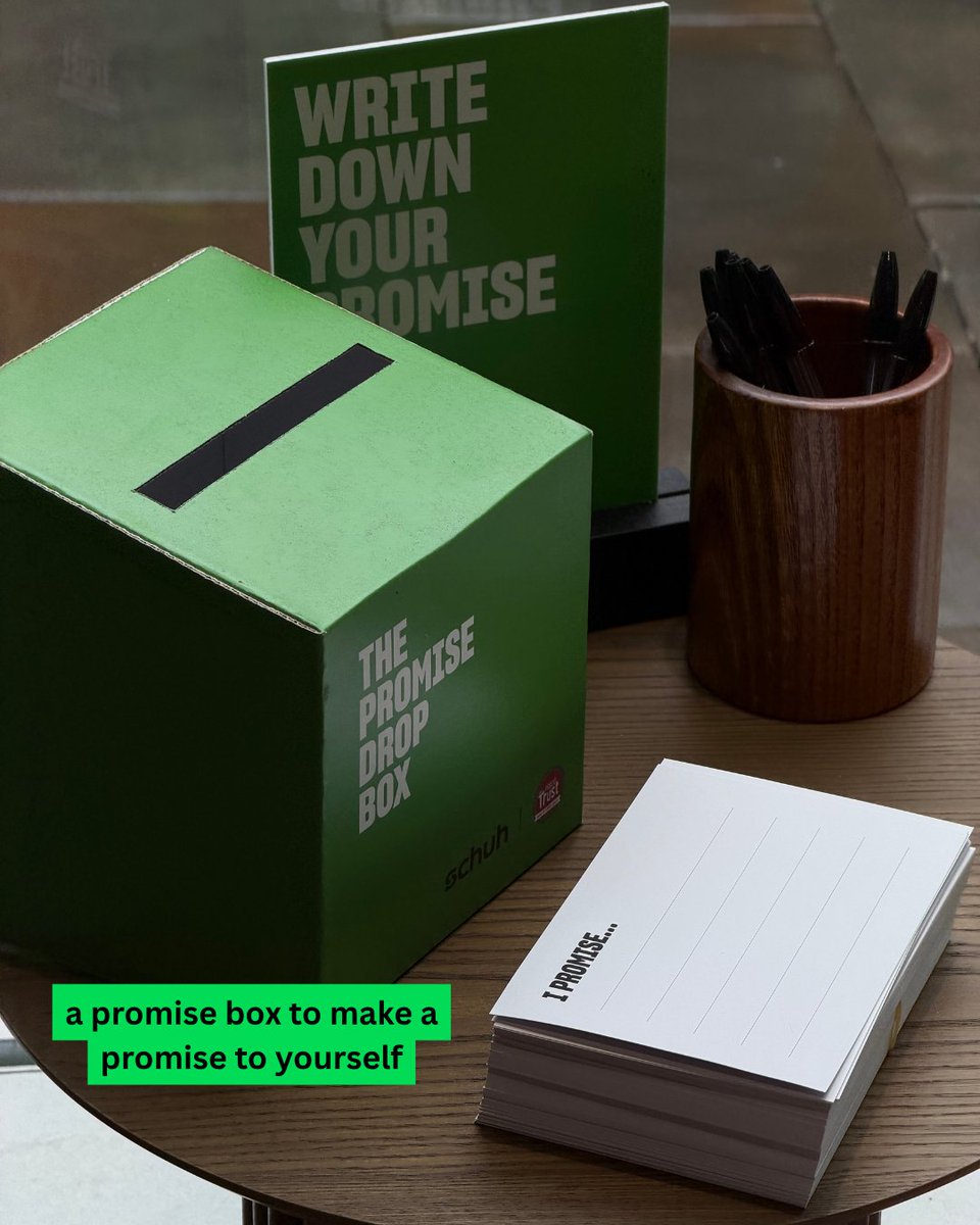 An image of a green suggestion box sitting on a wooden table. Text says "a promise box to make a promise to yourself".
