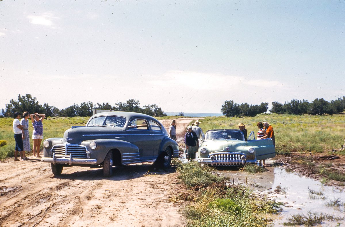 thomashawk's tweet photo. I bought a box of slides in a Los Angeles warehouse for twenty dollars.

Thanksgiving, 2019. 

An antique store was emptying an old warehouse. Inside was a pile of Kodachrome that almost went nowhere. The woman selling it said the slides had belonged to a photographer whose house had been liquidated after he died.

The boxes were addressed to Hugh Stevens Bell.

Bell was born in St. Joseph, Missouri, on January 10, 1899. He served in the Navy in 1918, finished Western Reserve University with honors, edited the campus paper, and worked at the Cleveland Museum of Natural History. He wrote for the Cleveland Plain Dealer, Nature Magazine, and the Journal of Geology. In the 1930s he joined the U.S. Indian Service and then soil conservation work. A son was born in Flagstaff in 1936. He did hydraulic research at Caltech and in 1942 published a USDA study on stratified flow in reservoirs. 

National Geographic published his photographs along the way. 

He lived out his last years in Sierra Madre and died there in 1989 at ninety.

What I found was not a few snapshots. It was a working life in color. 

Desert roads. Cars stuck in the mud. Families standing in the sun. Monument Valley. Native communities of the Southwest in the 1940s and 1950s. 

Mixed in were the personal frames. His people. His trips. The ordinary days that never make a magazine.

Kodachrome is why these still look alive. The dyes hold. Reds stay red. Skies stay blue. Seventy and eighty years later the film has not faded the way so many other color processes have. You can still feel the heat coming off the dirt.

I scanned them. I put them online. That box is what started my own personal collecting of what I've since learned is called vernacular photography. 

Since then I have collected tens of thousands of snapshots, slides and photo albums and organized them into many different digital albums on Flickr. 

Everything after that, the estate sales, the lockers, the orphaned pictures, began with the Hugh Stevens Bell Collection, sitting in a warehouse waiting to be thrown away.

Here is one of them.

The full collection is here if you are a fan of the American Southwest you will enjoy this trip back in a time machine:
https://t.co/TmOoHG50Oh