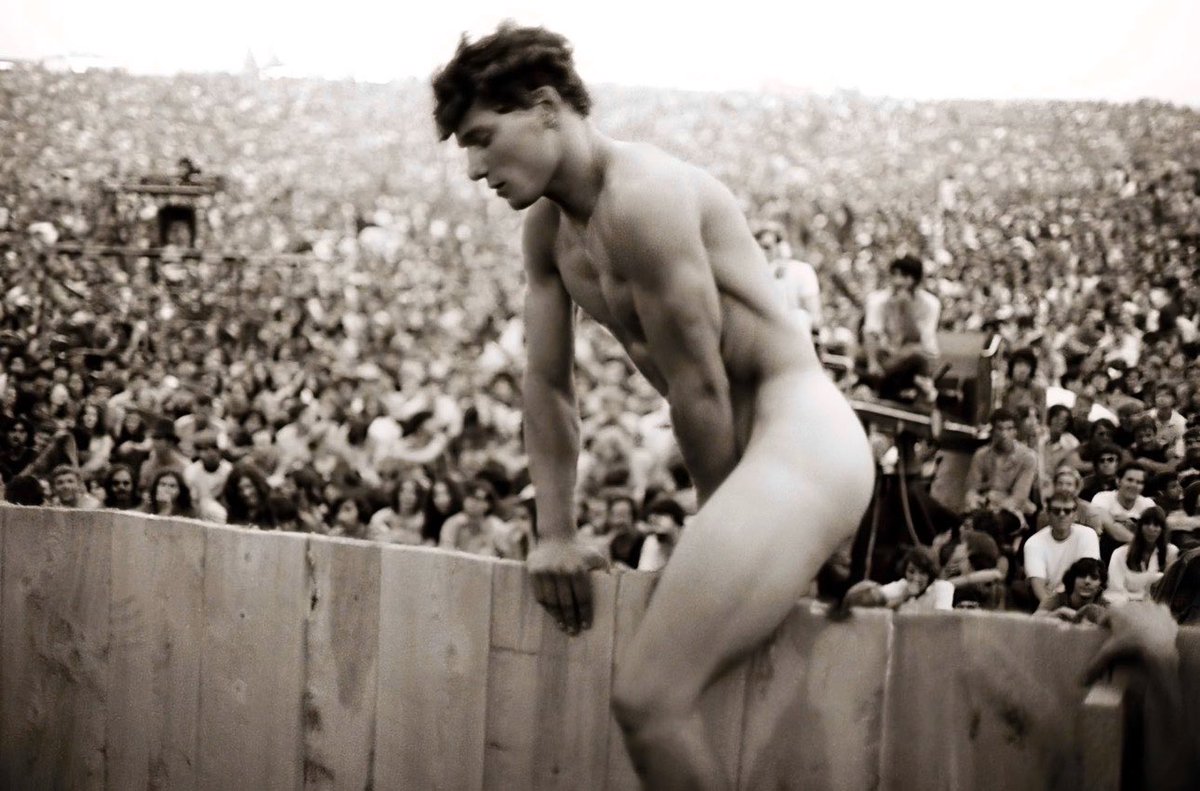 ThatOtherJJ's tweet photo. ᴠ ɪ ɴ ᴛ ᴀ ɢ ᴇ

This may be one of the most wonderfully Woodstock photographs ever taken.

Captured at the Woodstock Music & Art Fair in Bethel, New York, in August 1969, it shows a completely naked attendee casually climbing over a wooden barrier while an enormous crowd looks on. And yes, despite how unbelievable it looks today, the photograph is authentic.

The image is catalogued by Getty Images as “Woodstock Nudist.”