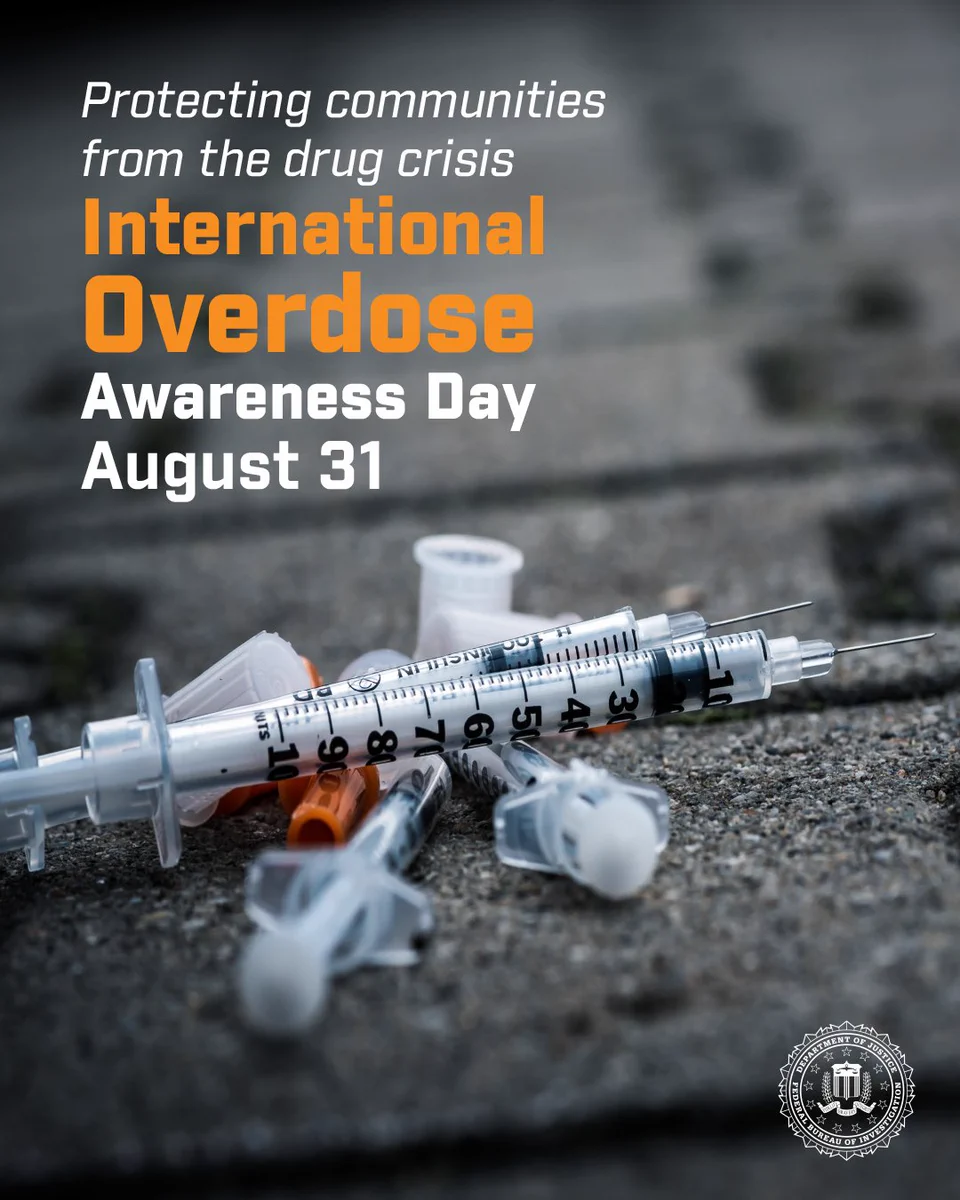 Discarded syringes on the ground highlighting International Overdose Awareness Day on August 31. FBI seal in bottom right corner.