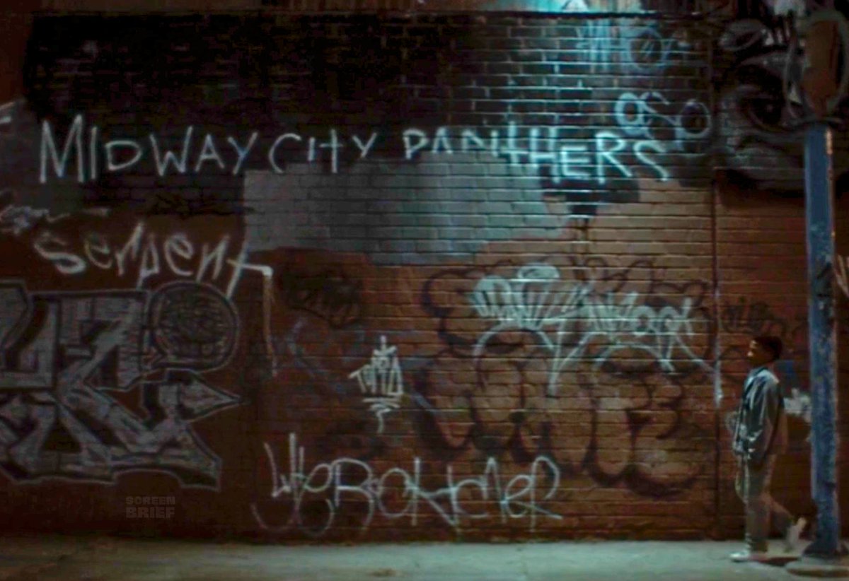 DCUBrief's tweet photo. Midway City is referenced

"Midway City Panthers” graffiti is seen when little John is walking home. It is the home of Hawkman and Hawkgirl, in Michigan. In the comics, John Stewart grew up in Detroit, Michigan. https://t.co/u32z8ByGaI
