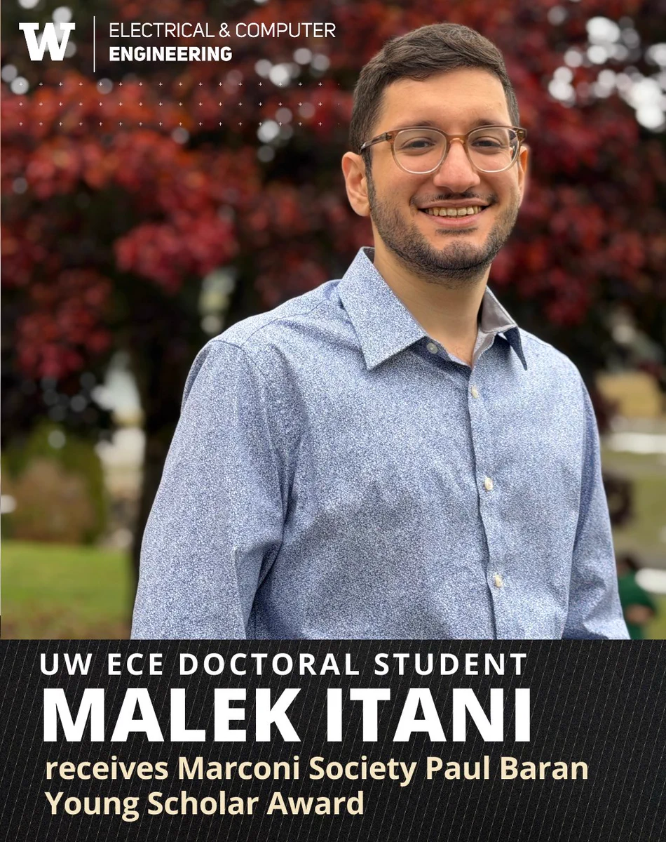 UW ECE doctoral student Malek Itani poses outside for a portrait, in front of a large tree with red leaves, wearing glasses and a densely-patterned blue button-up shirt. He is smiling and looking at the camera.